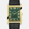 Analoog horloge in goudkleur en smaragdgroen