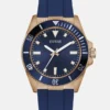 Analoog horloge in roségoudkleurig en blauw siliconen