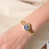 Analoog horloge van gerecycled staal met kristallen