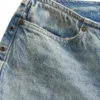 Denim broek met oogjes en lage taille