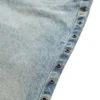Denim broek met oogjes en lage taille