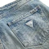 Denim broek met oogjes en lage taille