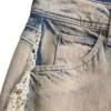 Denim broek met vetersluiting en uitlopende pijpen