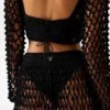 Gehaakte crop top met pompons