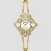 Goudkleurig analoog horloge met bloemmotief Goudkleurig analoog horloge met bloemmotief