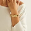 Goudkleurig analoog horloge met diamant Goudkleurig analoog horloge met diamant