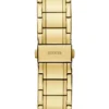 Goudkleurig en groen analoog horloge