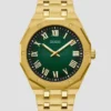 Goudkleurig en groen analoog horloge met zonnestraalpatroon Goudkleurig en groen analoog horloge met zonnestraalpatroon