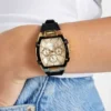 Goudkleurig en zwart multifunctioneel horloge met siliconenband