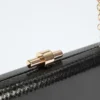 Goudkleurige python clutch