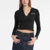 Slanke top met capuchon en geborduurd logo Slanke top met capuchon en geborduurd logo